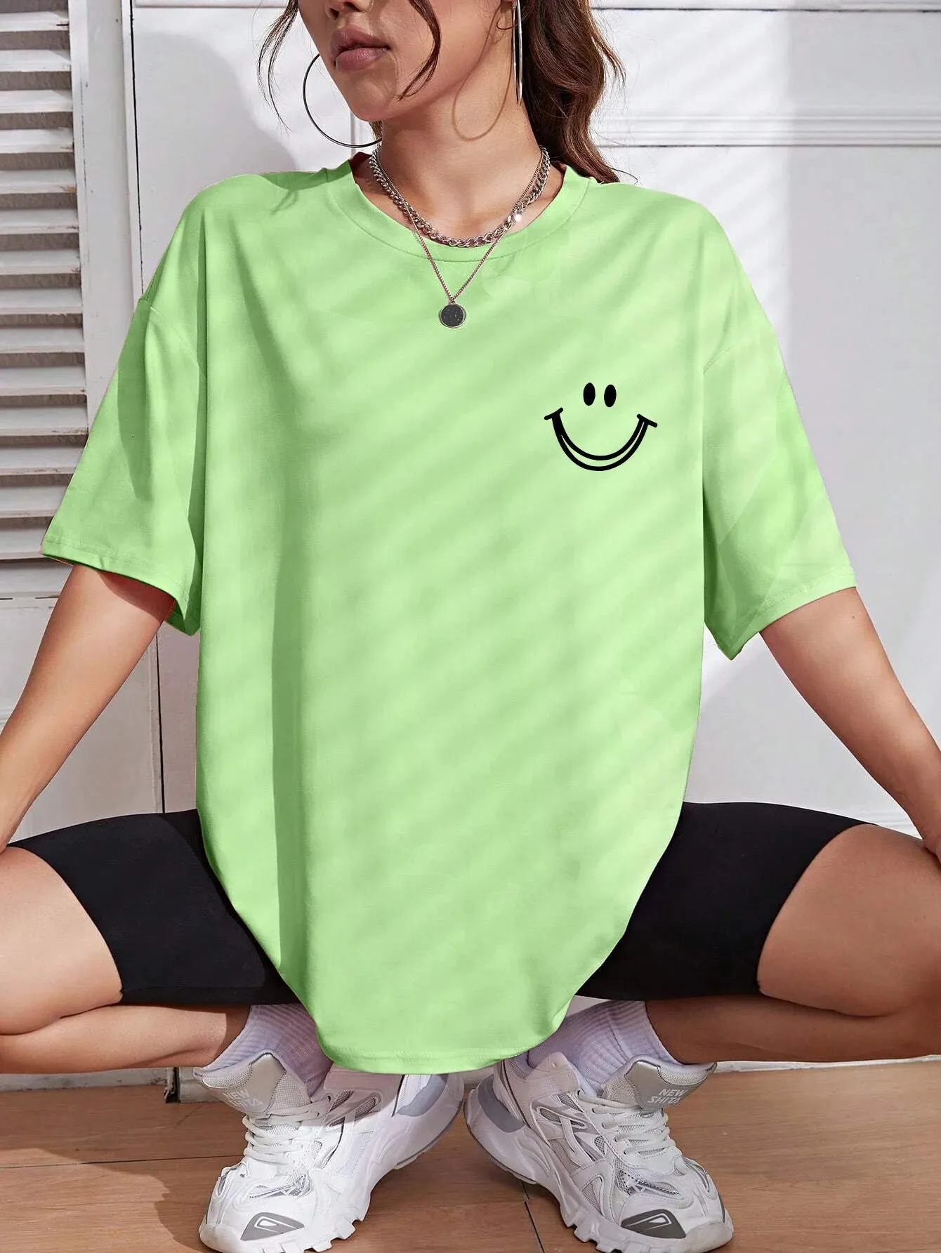 Smiley face oversized cotton graphic tee for the ladies